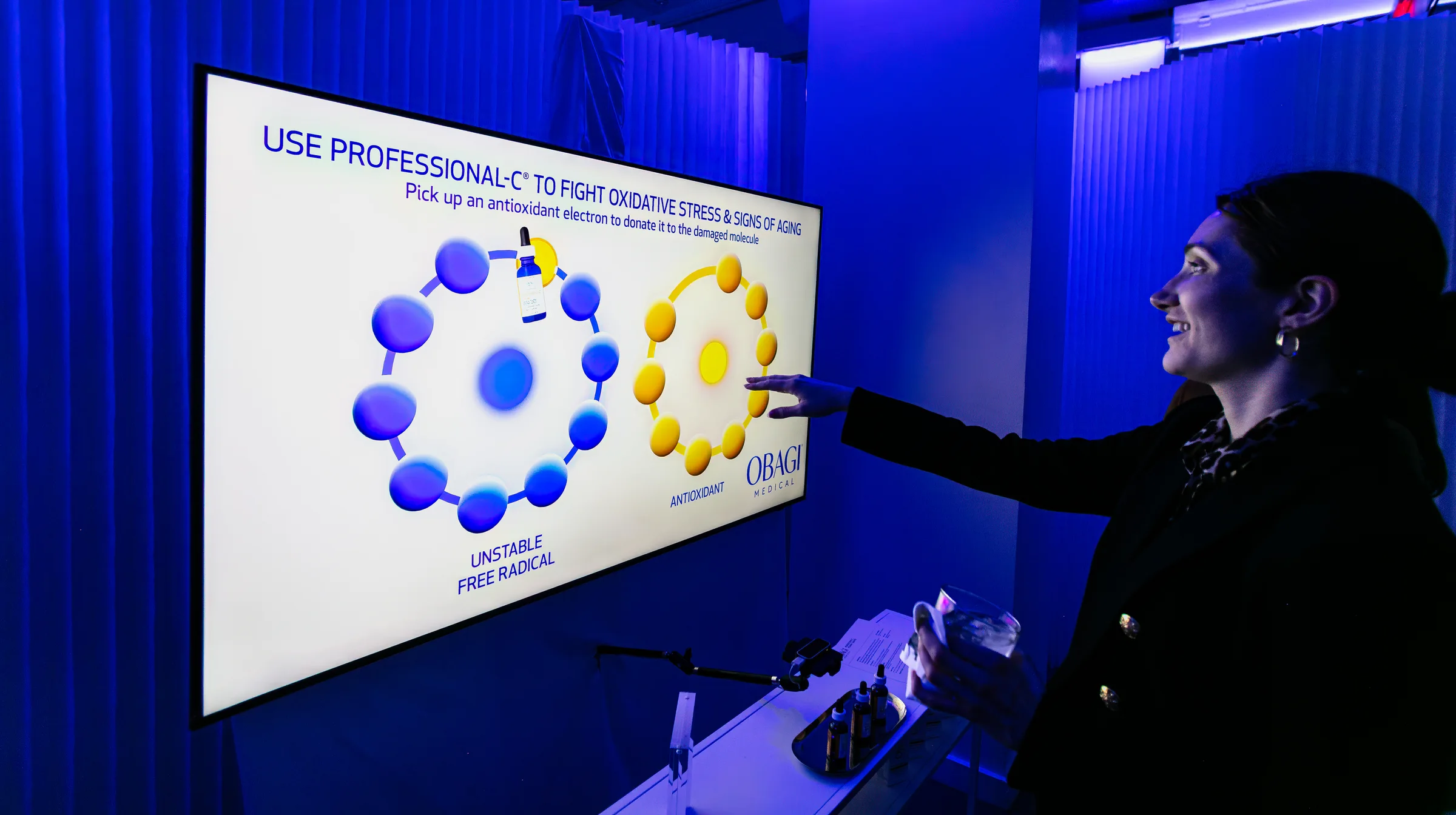 Interactive molecule transfer visual concept on truss-mounted display