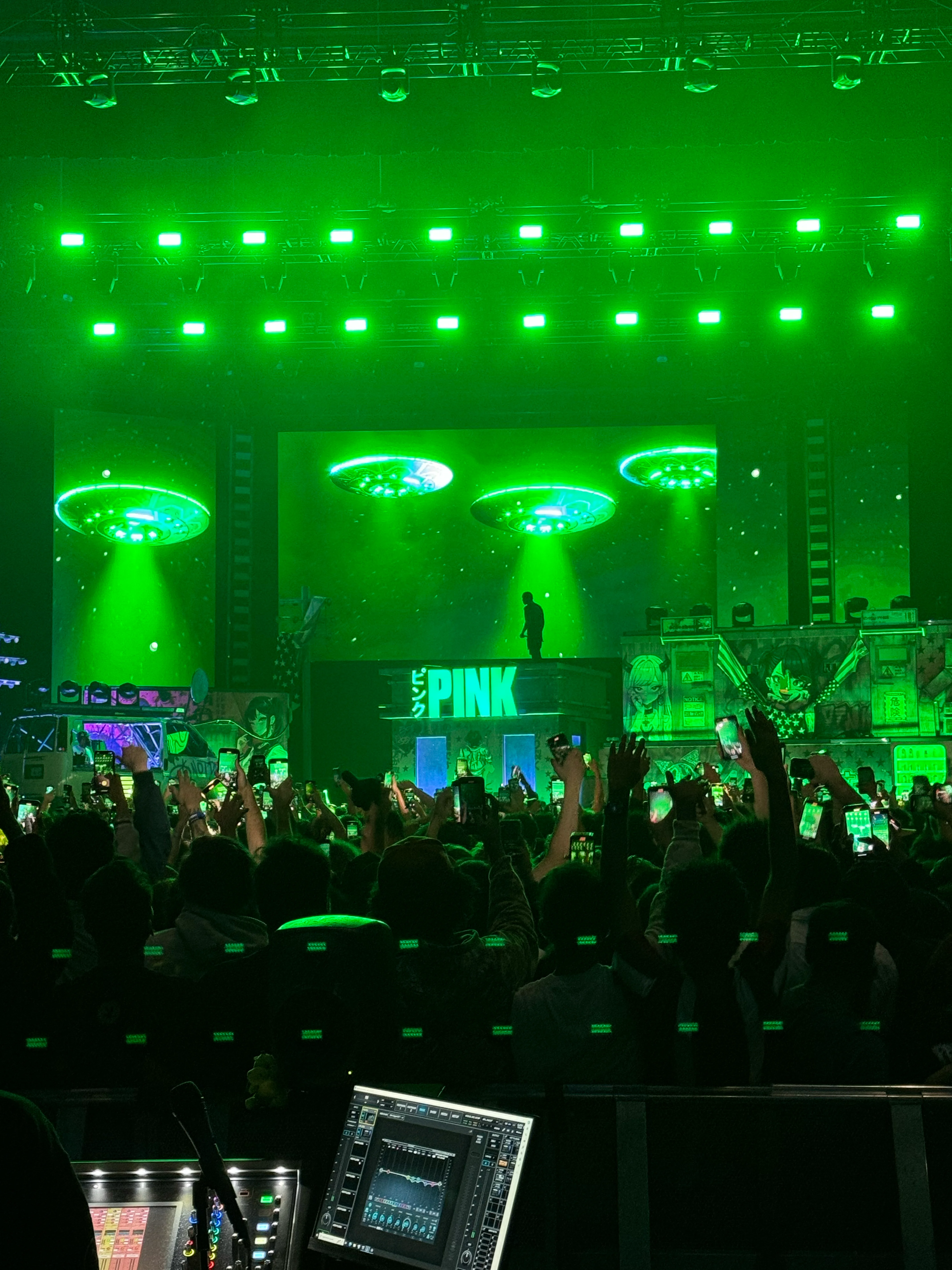 UFO themed stage visuals during a live performance